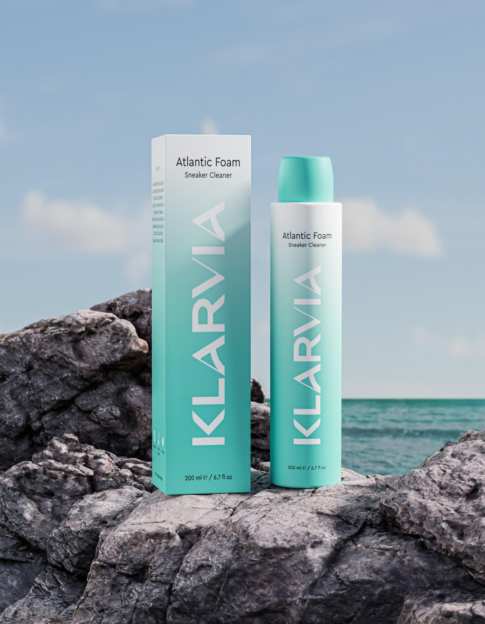 KLARVIA Atlantic Foam sneaker cleaner bottle and box on rocks with ocean background